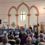 Hustings held in a church, panel and audience