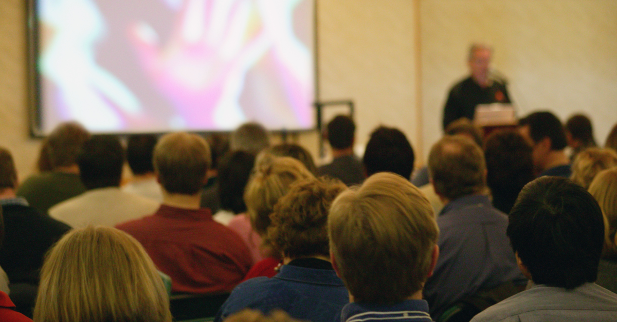 Image of people watching a presentation