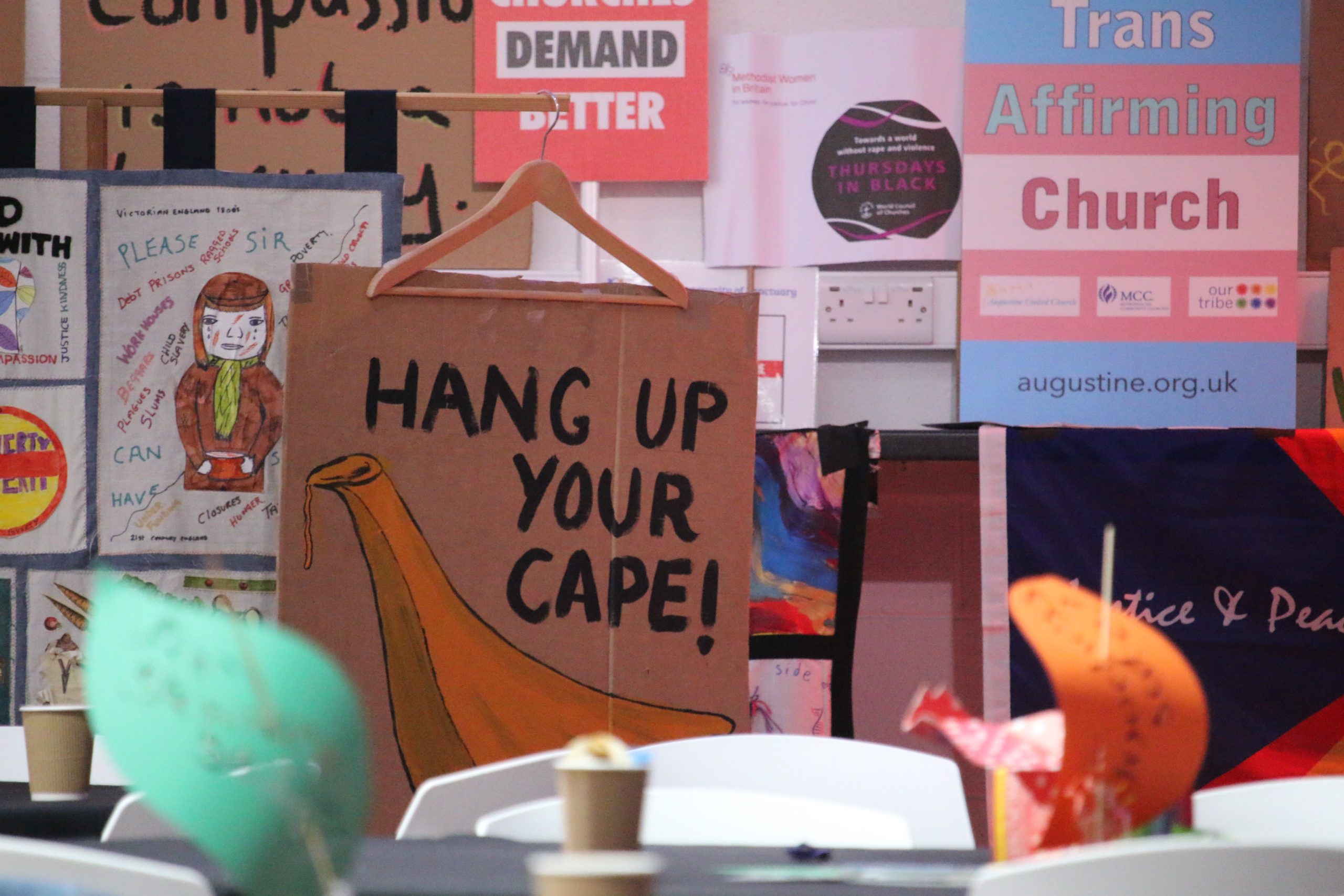 Protest Signs at ForGood25 (Photo by Kevin Snyman)