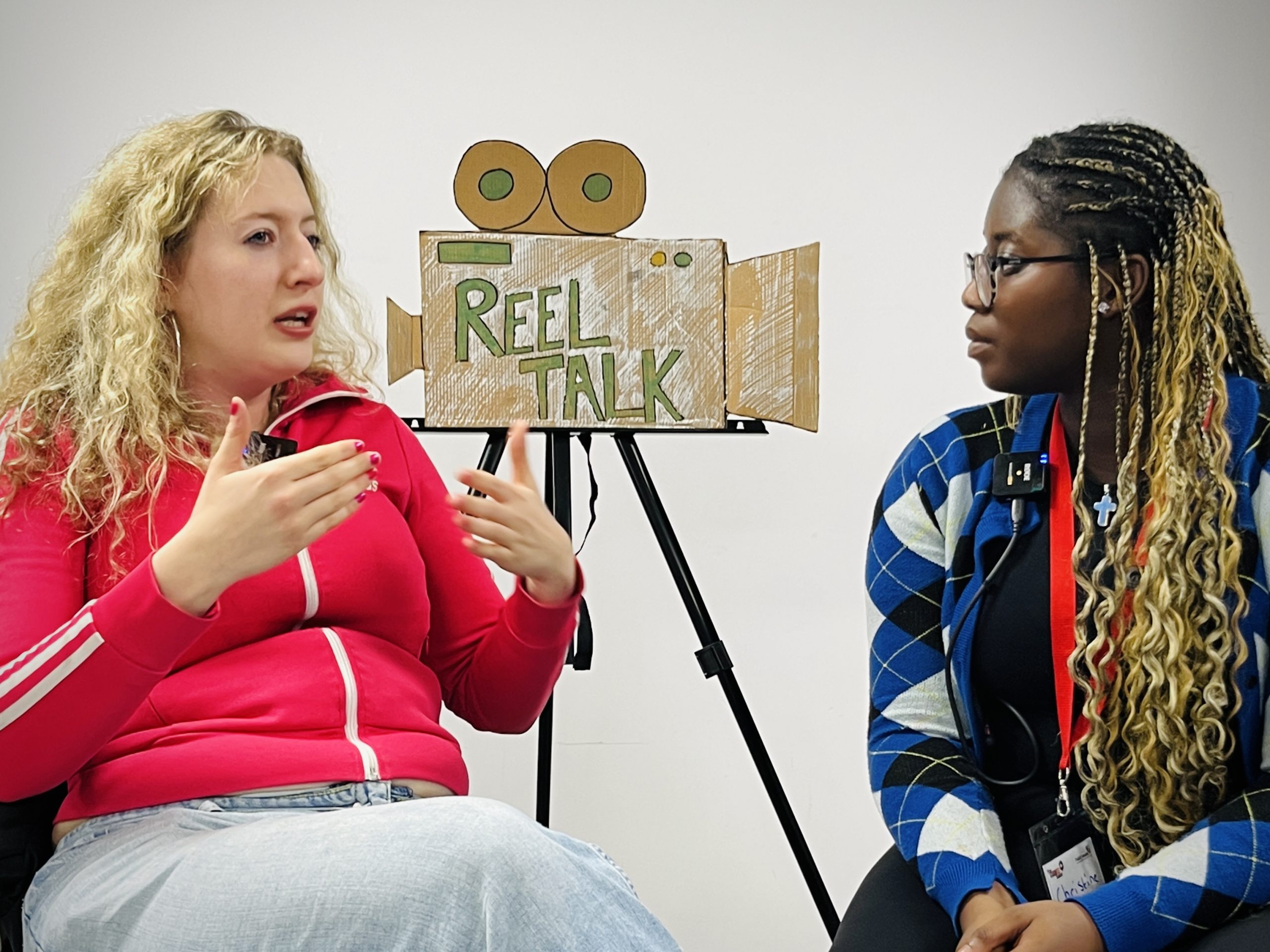 Volunteer Christine Ntim speaking to a participant in Reel Talk at ForGood25 (Photo by Steve Walker)