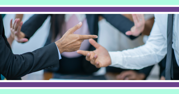 A group gesturing with their hands as they have an impassioned conversation.